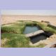 Wasserbecken in der Oase Ain-Khadra am Rande der Weissen Wüste